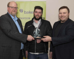 Ryan Hoffman from Baker Tilly presents the Large Business of the Year Award to NL Construction Inc