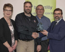 Yorkton Lions Club accepts the Community Merit Award sponsored by SaskTel from Greg Ottenbreit, MLA